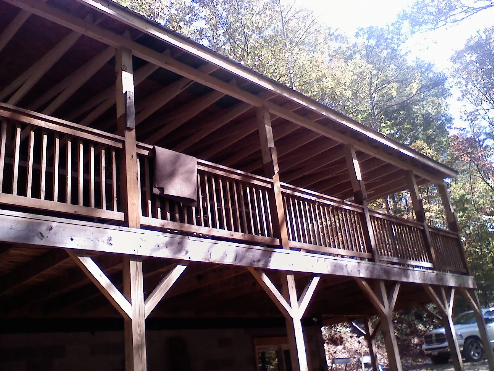 Timber framing under a new elevated porch and deck — Roof Leak Repair in North Granby by Roofing Brothers